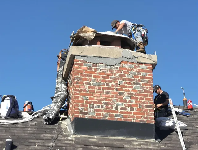 Port St. Lucie Chimney Sweep installing a custom chimney crown in Port St. Lucie, FL