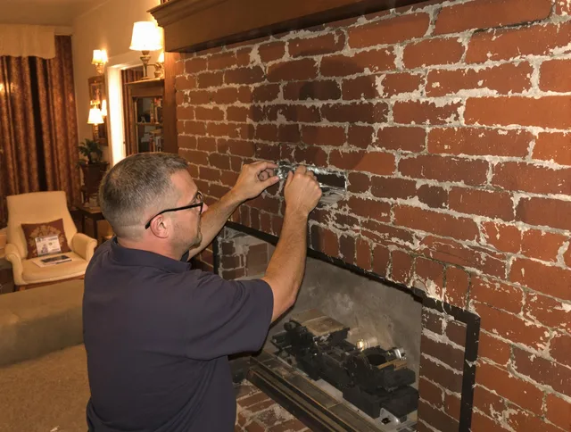 Port St. Lucie Chimney Sweep expert fixing a fireplace in Port St. Lucie, FL